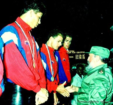 Receiving medals on the podium from Fidel Castro