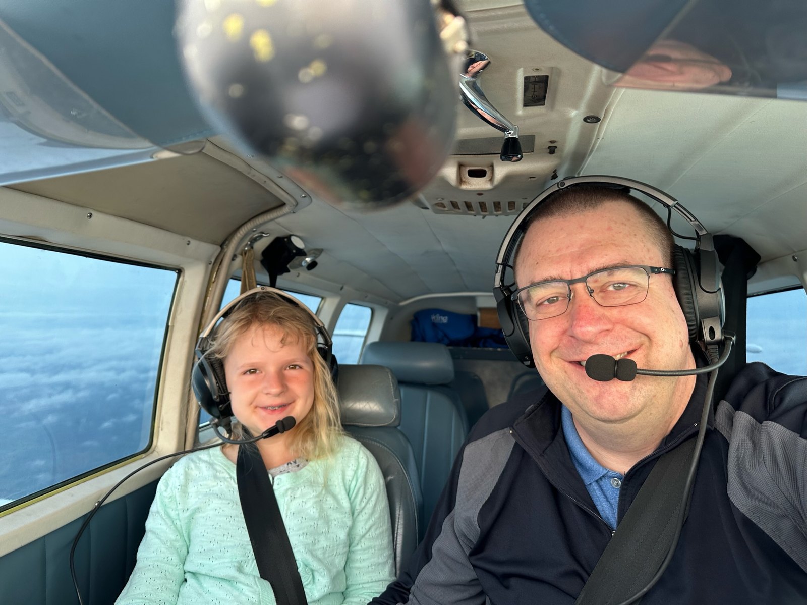 Tim Quigley flying with his daughter in the cockpit